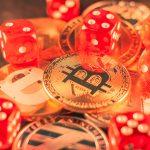 closeup shot some bitcoins red dice